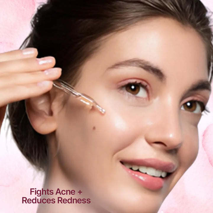 A girl face with serum dropper with caption "Fights Acne + Reduces Redness"