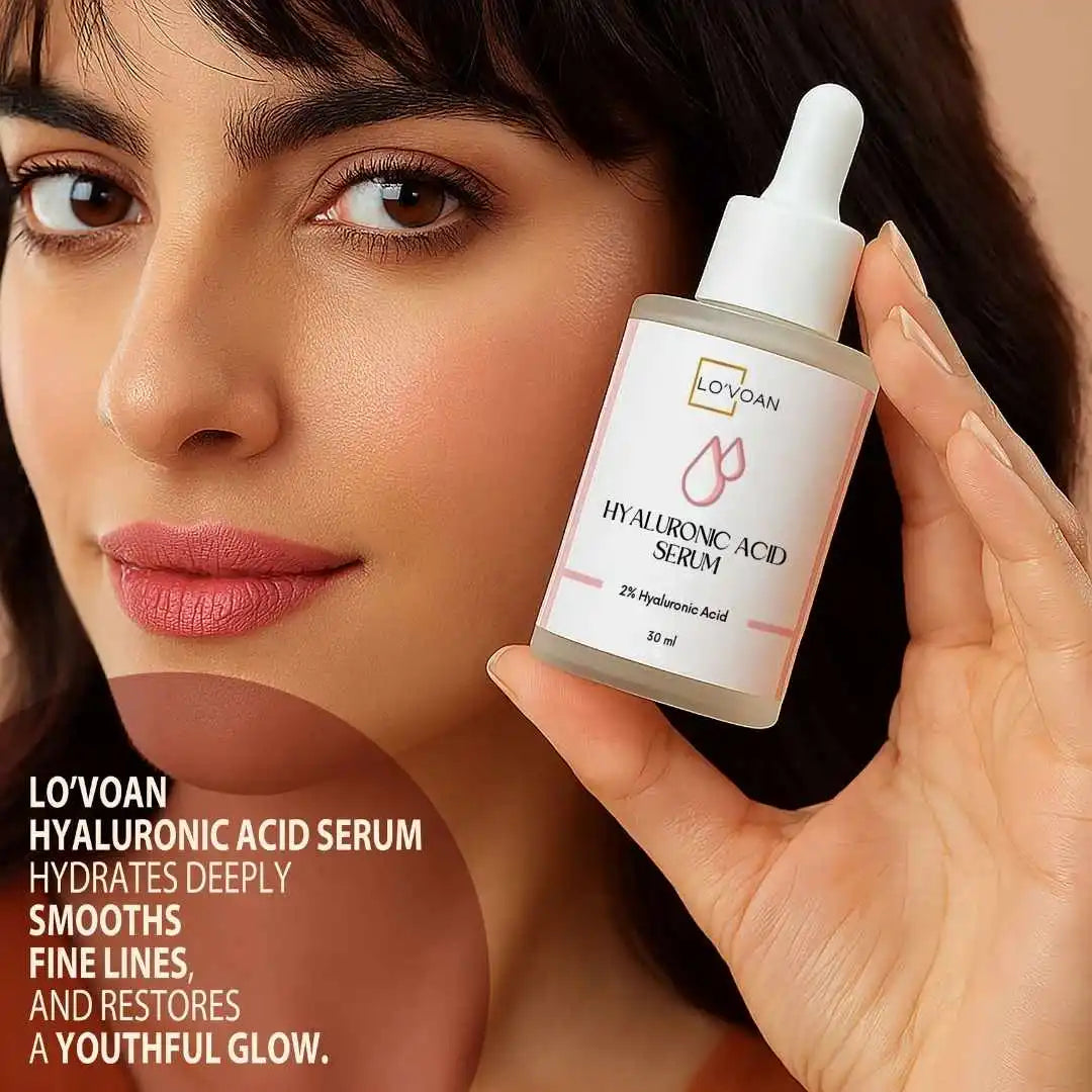 Woman holding a bottle of best Hyaluronic Acid Serum close to her face by Lo'voan