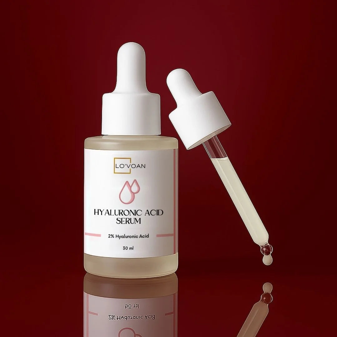 Hyaluronic acid serum bottle with dropper on a red background
