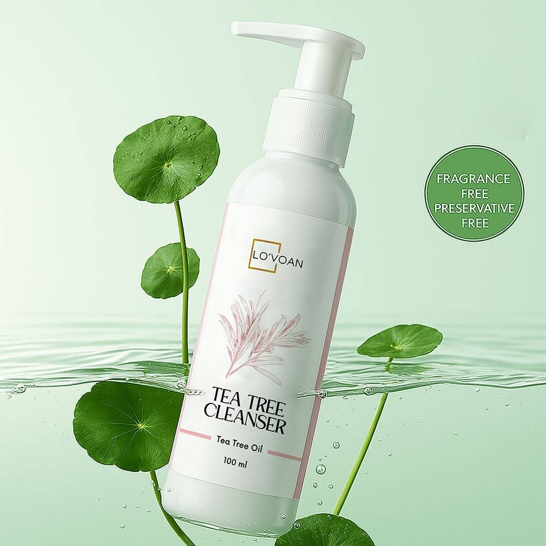 Lo'voan Tea Tree Cleanser 100 ml bottle dipping in water showing plants behind